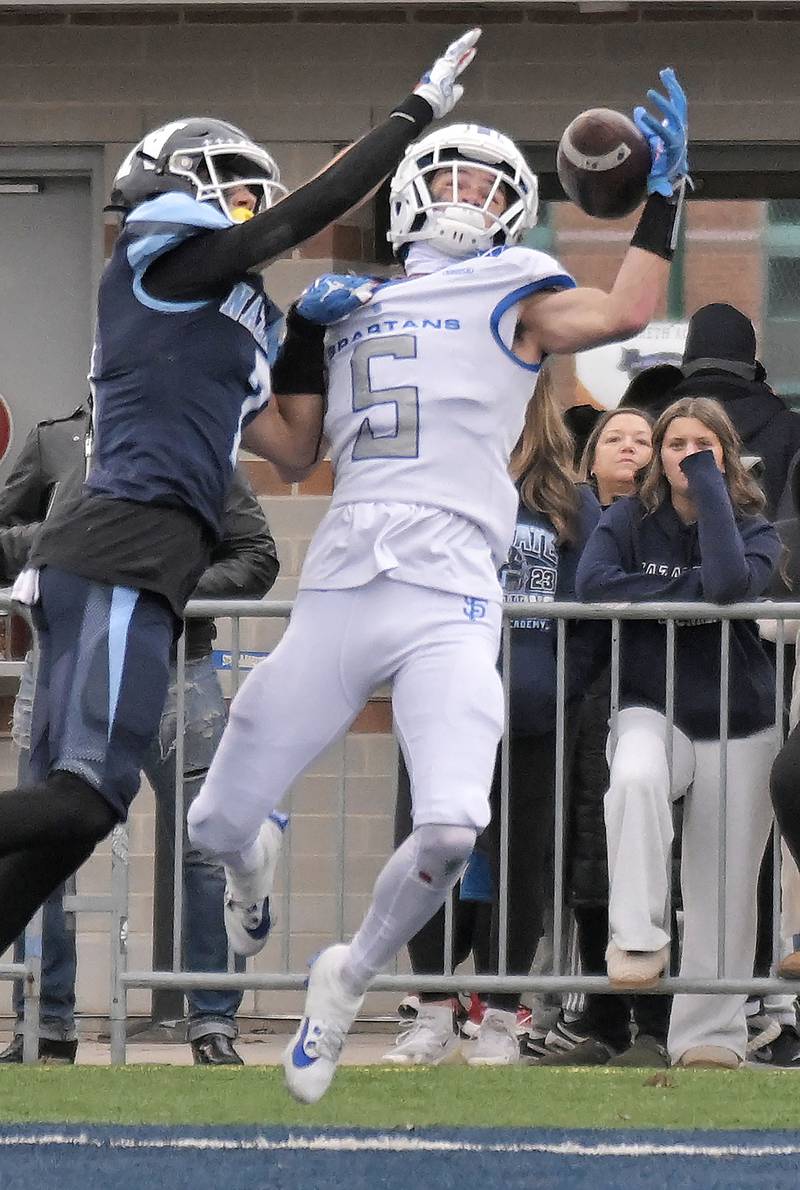 St. Francis’ Zach Washington can’t control a pass in the endzone as Nazareth’s Jake Cestone defends in the IHSA Class 5A state semifinal football game in La Grange on Saturday, Nov. 23, 2024.