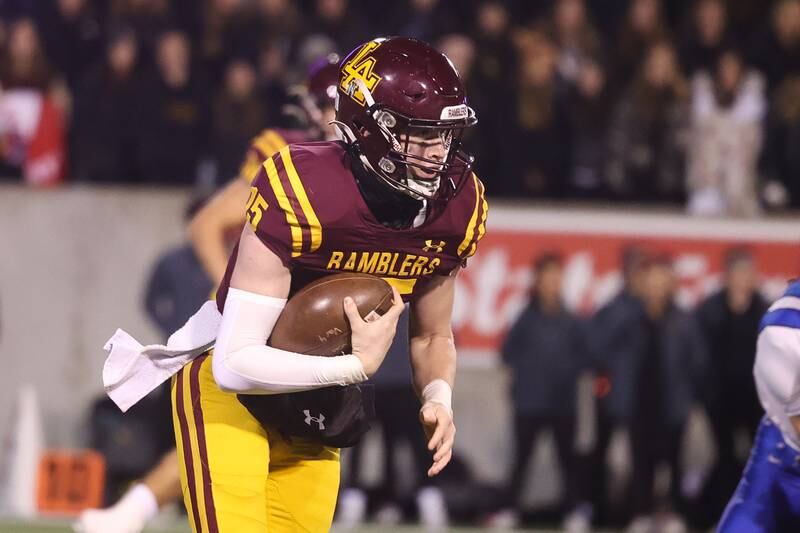 Loyola’s Ryan Fitzgerald keeps the ball on a run against Lincoln-Way East in the Class 8A championship on Saturday, Nov. 25, 2023 at Hancock Stadium in Normal.