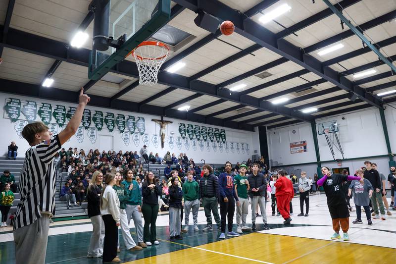 River Valley Special Rec player Reem Abdelmeguid tosses in a free throw as Bishop McNamara's Coen Demack calls it in during the halftime contest during the RVSRA's game against Lincolnway Special Recreation Association at Bishop McNamara on Friday, Jan. 30, 2026.