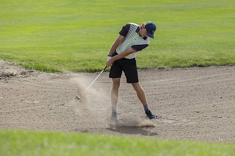 Geneseo’s Hayden Moore blasts out of the bunker on #12 Wednesday, Sept. 27, 2023 during the class 2A golf regionals at Deer Valley Country Club.