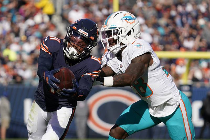 Chicago Bears wide receiver Darnell Mooney, left, catches the pass against Miami Dolphins cornerback Kader Kohou during the first half, Sunday, Nov. 6, 2022 in Chicago.