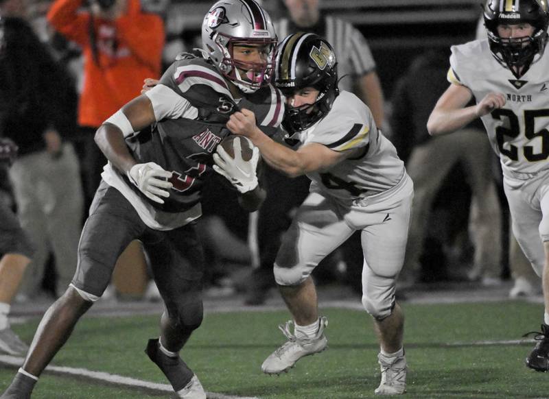 Antioch’s Martin Cohen is caught by Grayslake North’s Ethan Ventura in a football game in Antioch on Friday, Oct. 4, 2024.