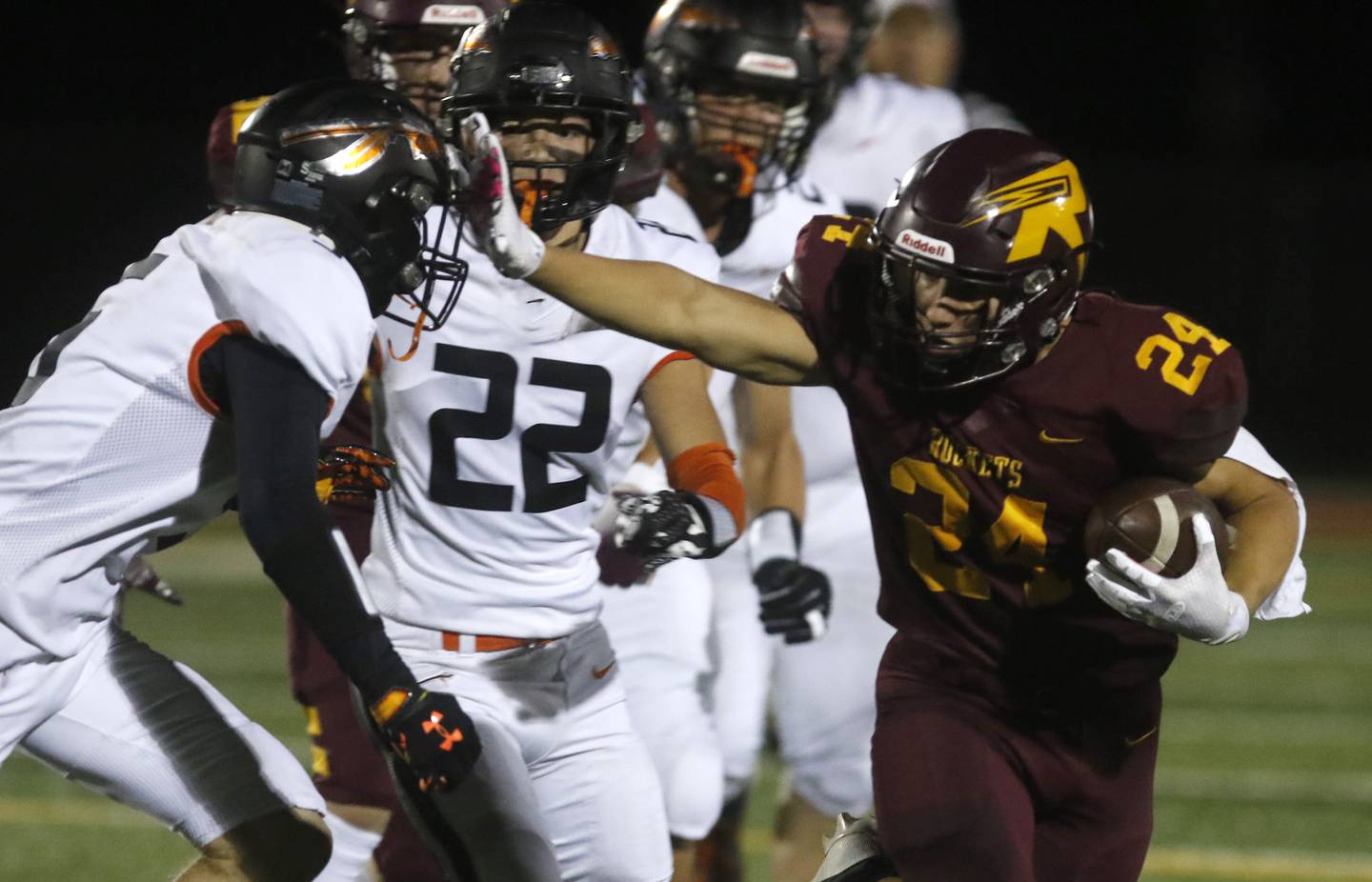 Richmond-Burton's Hunter Carley stiff arms Sandwich's Cole Leeper during a Kishwaukee River Conference football game on Friday, Oct. 4, 2024, at Richmond-Burton High School.