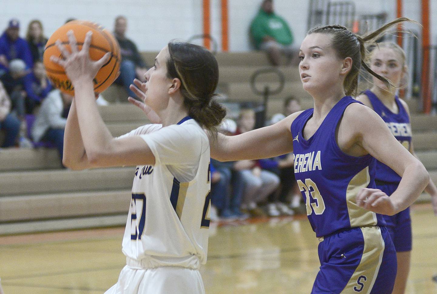 Marquette’s Kaitlyn Davis gets past Serena’s Jenna Setchell and sets for a shot during the second quarter of Saturday's championship of the Falcon-Irish Thanksgiving Tournament at Flanagan-Cornell High School.