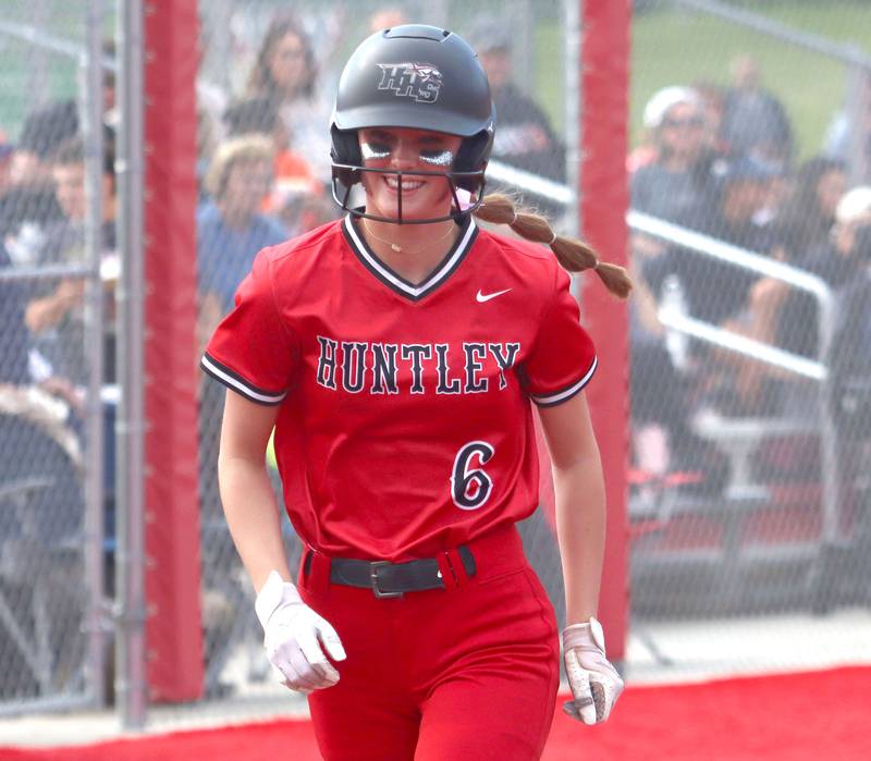 Huntley’s Ava McFadden is all smiles as she heads toward home plate on a home run against DeKalb in IHSA Class 4A Sectional Semifinal softball action at Barrington High School in Barrington on Wednesday, June 4, 2025.