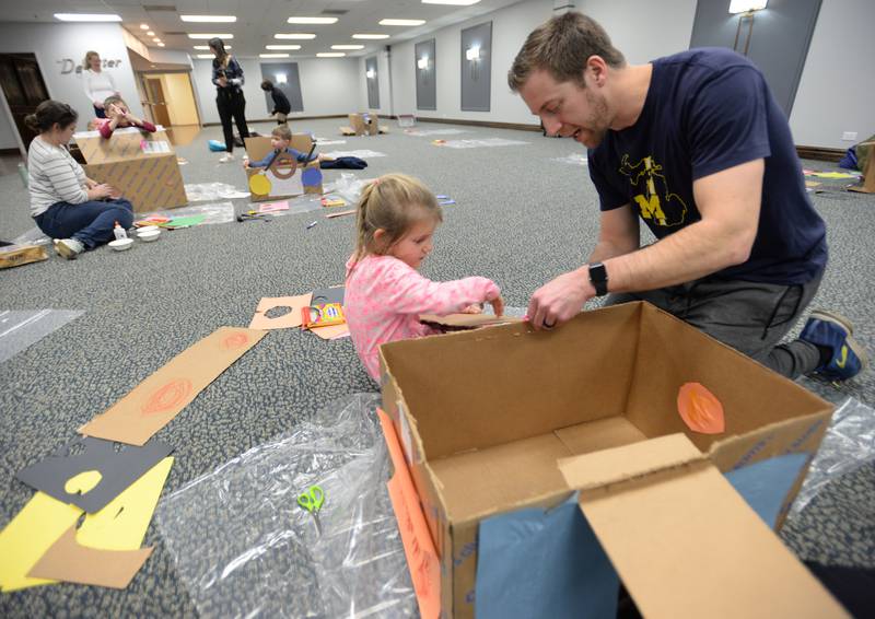 Dave Folds of Lagrange Park and his daughter Mae put her car together during the Drive In Movie event held at the Park District of La Grange Friday, Feb 23, 2024.