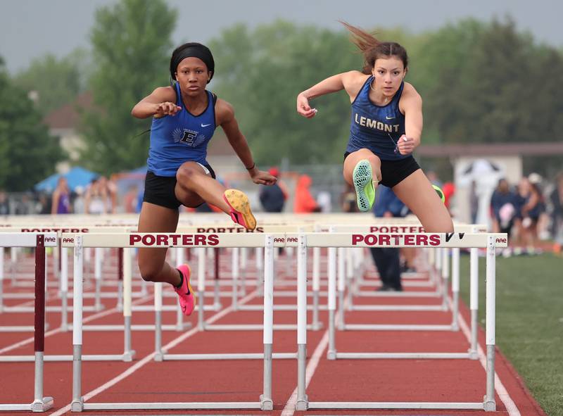 Lemont's Juliette Reyes (R) battles with Lincoln Way's Kendall Crossley (L) in the 100m hurdles during the girls varsity track and field 3A Lockport sectional on Friday, May 12, 2023.