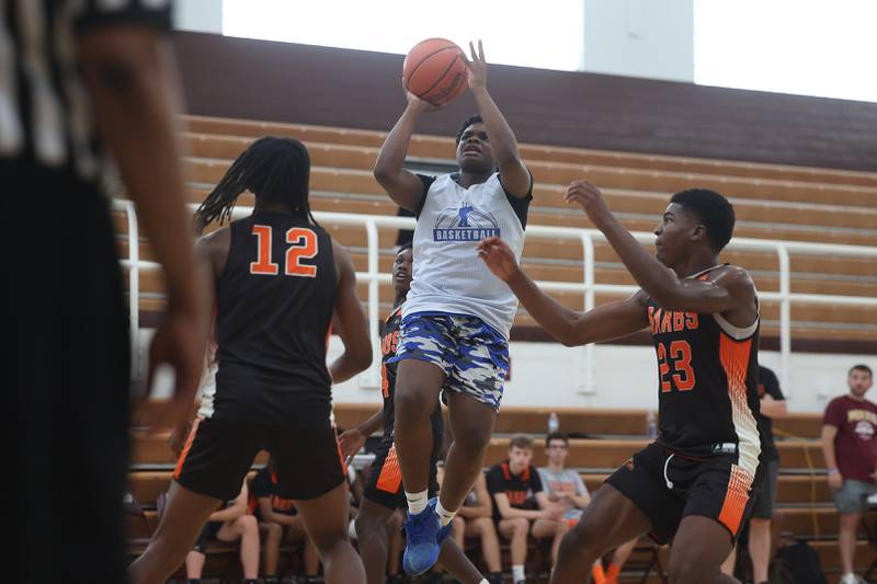 Joliet Central’s JeVontae McCann puts up a shot against DeKalb at the 37th Morris Boys Shootout on Tuesday, June 25, 2024.