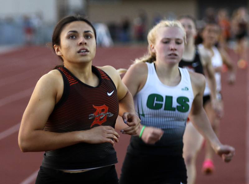 DeKalb’s Korima Gonzalez wins the 800 meter run in front of Crystal Lake South’s Abby Machesky during the Huntley IHSA Class 3A Girls Sectional Track and Field Meet on Wednesday, May 8, 2024, at Huntley High School.