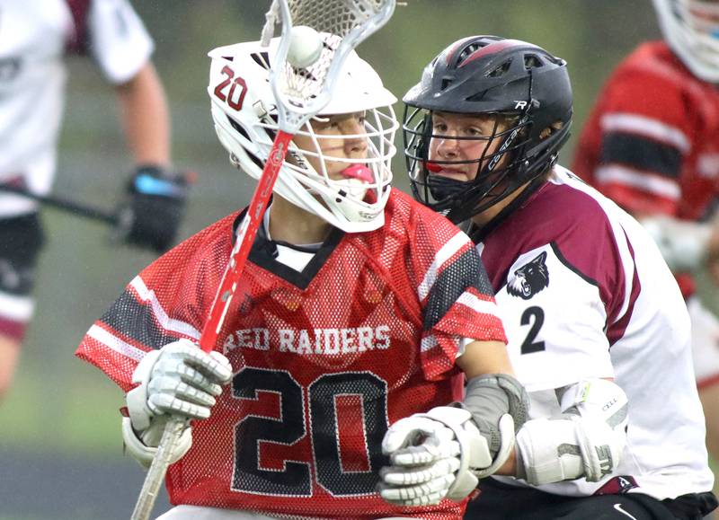 Huntley’s Cameron Abordo moves the ball  in varsity boys lacrosse at Prairie Ridge  High School in Crystal Lake on Thursday, May 1, 2025.