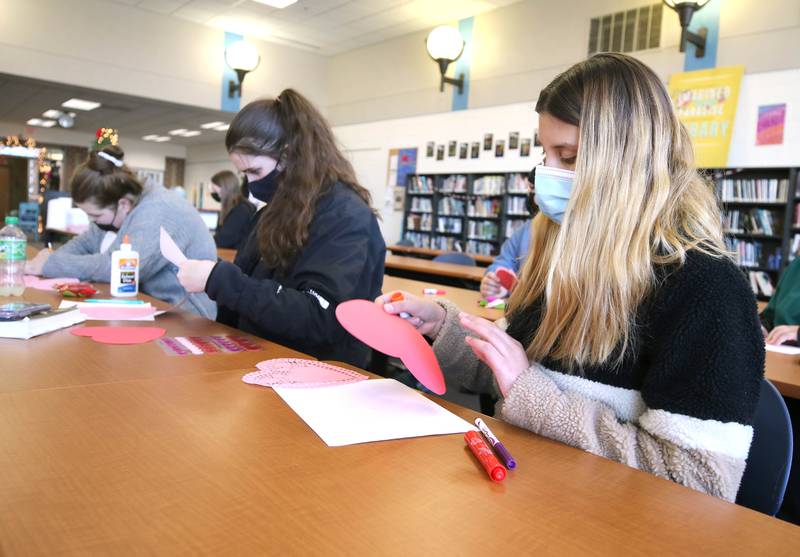 Genoa-Kingston students in conjunction with the Genoa-Kingston High School Impact Club make Valentines Day cards Tuesday, Jan. 25, 2022, in the library at the school. The cards they are making will be part of “Valentines for Seniors,” a card drive for local seniors living in residential care facilities, sponsored by State Representative Jeff Keicher, R-Sycamore, and State Senator Dave Syverson R-Rockford.