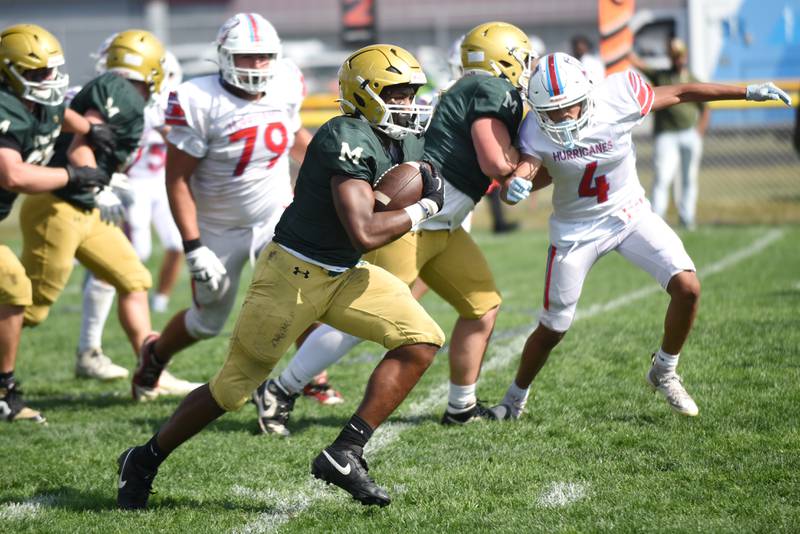 Bishop McNamara's Julius May runs for a touchdown during a home game against Marian Central Saturday, Oct. 4, 2025.