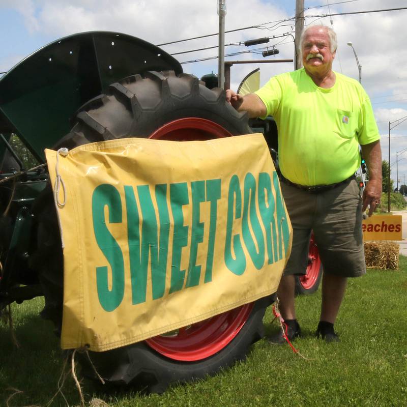 Rob Wessels, owner of Wessels’ Family Farm, with his tractor Thursday, July, 18, 2024, at the market in DeKalb.