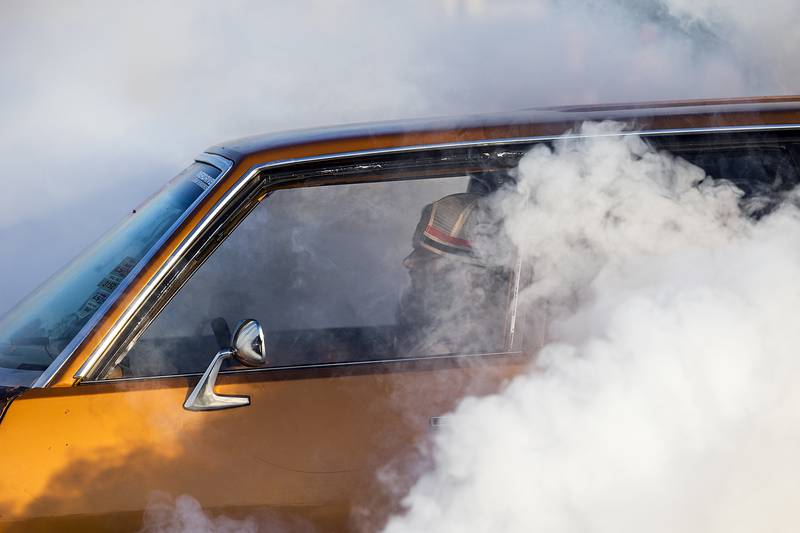 Smoke billows from the spinning tires of a burnout artist Thursday, June 19, 2025, in Rock Falls.