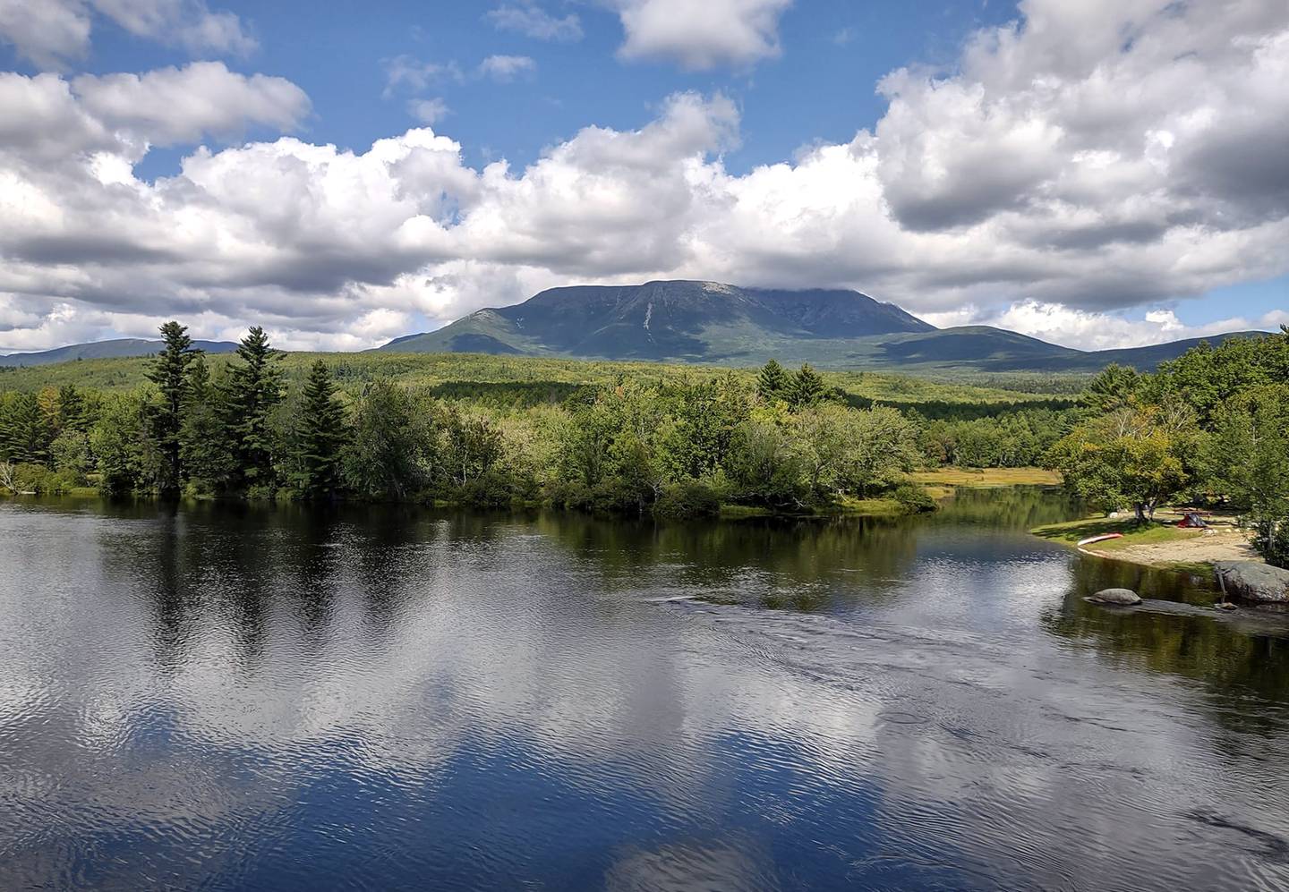 Mount Katahdin is visible from the Abol Bridge, which carries Golden Road over the West Branch Penobscot River in Piscataquis County, Maine. The mountain marks the end of the Appalachian Trail.