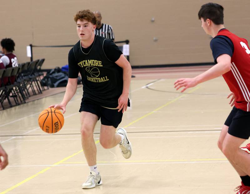Sycamore’s Aidan Mesenbrink brings the ball up the court Friday, June 20, 2025, during their game against Marmion in the DeKalb Live summer tournament at DeKalb High School.