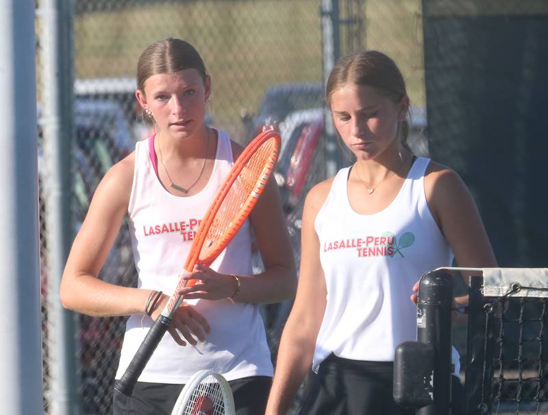 L-P number one doubles team members April Pescetto and Addi Piecha walk off the court after playing Ottawa on Tuesday, Sept. 16, 2025 at Ottawa High School.