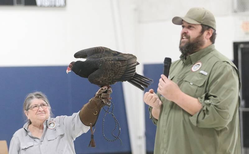 Jane Seitz Illinois Raptor Center executive director and Travis Wilcoxen Illinois Raptor Center board president present a Turkey vulture during a live birds of prey show during Eagle Watch Weekend on Saturday, Jan. 25, 2025 at the Utica Village Hall.