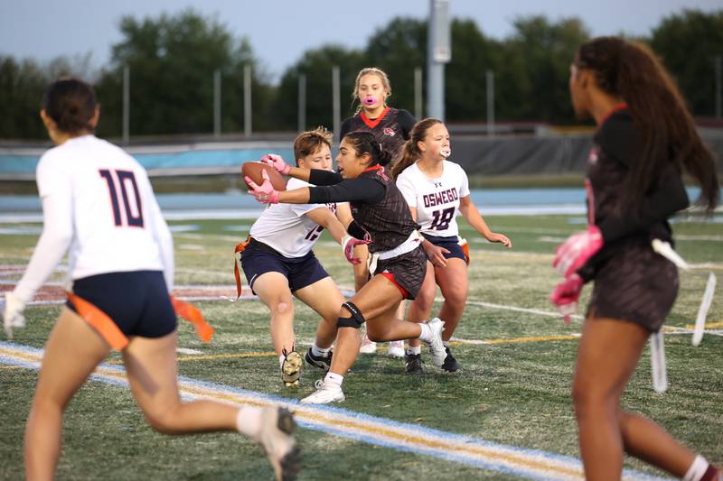 Yorkville's Bella Esquivel reaches out for a first down as Oswego's Mak Hill closes in during the Foxes' 2-1 overtime victory over Oswego in the IHSA Kankakee Regional championship game on Thursday, Oct. 9, 2025.