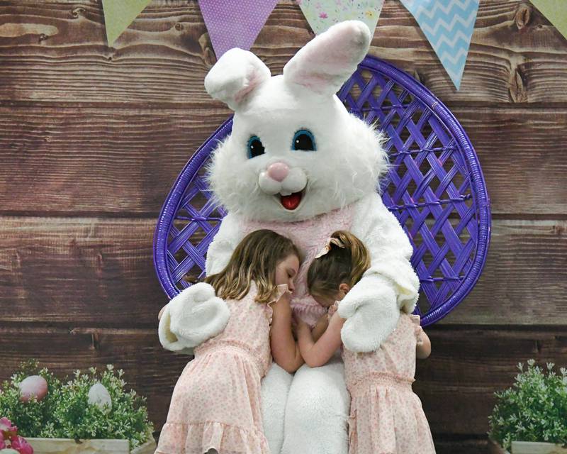Sophie Benjamin, 5, and her sister Ava Benjamin, 3, hug the Easter bunny on Saturday March 29, 2025, during the breakfast with the bunny event held at the La Grange Park District Recreation Center.