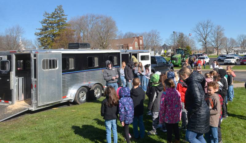 Forreston High School student Dawson Heslop greets grade school students as he lays down the rules at the Forreston FFA's Ag Day on Friday, April 12, 2024. In addition to the petting zoo, the event included farm tractors, and lessons from Forreston High School  FFA members. Heslop is a junior at Forreston High School.