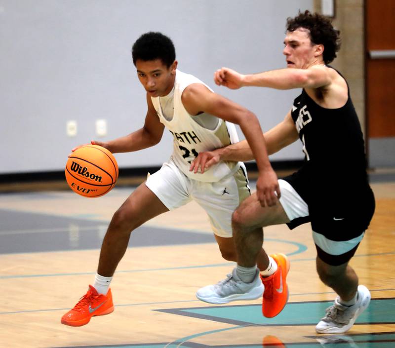 Grayslake North's Will Foley brings the ball up the court against Prairie Ridge's Luke Vanderwiel during the 2025 Hoops for Healing tournament basketball game on Wednesday, Nov. 26, 2025, at Woodstock North High School.