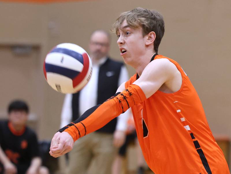 DeKalb’s Joseph Stratton bumps the ball Tuesday, April 21, 2026 during their match against Naperville North JV at DeKalb High School.