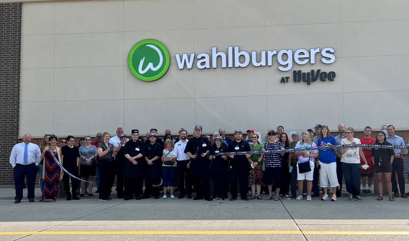 Dozens of community members, Hy-Vee employees and area business owners flocked to the Hy-Vee in Sycamore on Aug. 22, 2023 for the grand opening of the Wahlburgers location inside the grocery store.