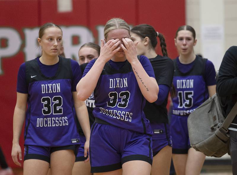 Dixon’s Jessie Pitman leads her teammates off the court after falling to Lincoln in the class 3A super sectional Monday, Feb. 26, 2024 at LaSalle-Peru High School.