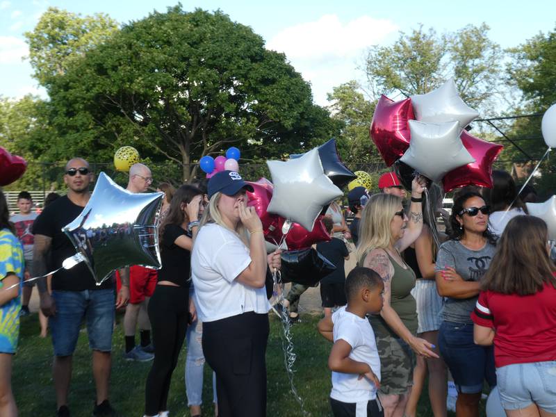 A prayer vigil and balloon release was held at Oriole Park in Chicago on Monday night, August 1, 2022 to mourn the loss of seven killed, including Lauren Dobosz and her four children, in a tragic car crash that occurred Sunday on I-90 near Hampshire.