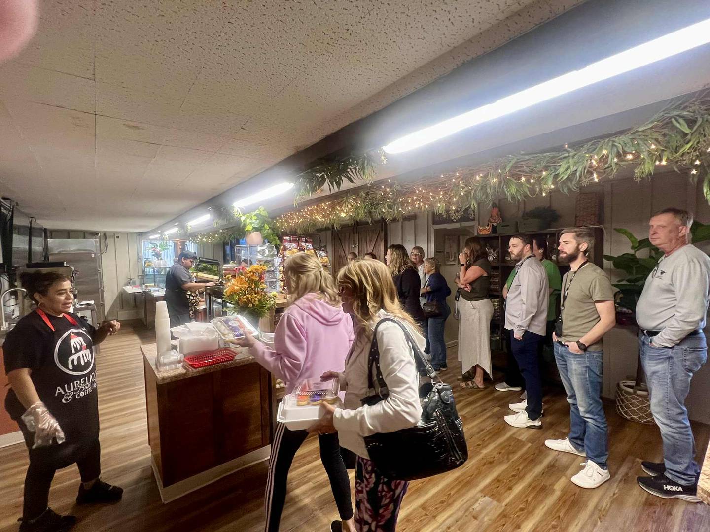 Customers line up for food Thursday, Oct. 9, during the grand opening of Aurelio's Cake Factory Bistro & Cafe at 2907 Locust St. in Sterling.