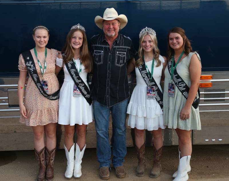 Tracy Lawrence poses with the Marshall-Putnam Fair royalty (from left) Junior Miss first runner up Isabelle Knuckey, Junior Miss Stell Rowe, queen Mikayla Frawley and queen runner up Kayla Shafer during the 103rd annual Marshall-Putnam Fair on Thursday, July 18, 2024 in Henry.