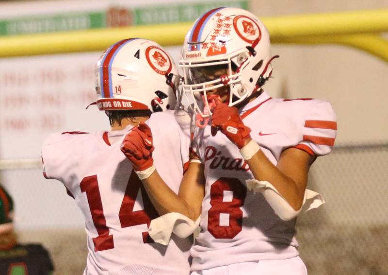 Ottawa's Archer Cechowiz celebrates with teammate Bryson Valdez after scoring a touchdown on Friday, Oct. 3, 2025 at Howard Fellows Stadium.