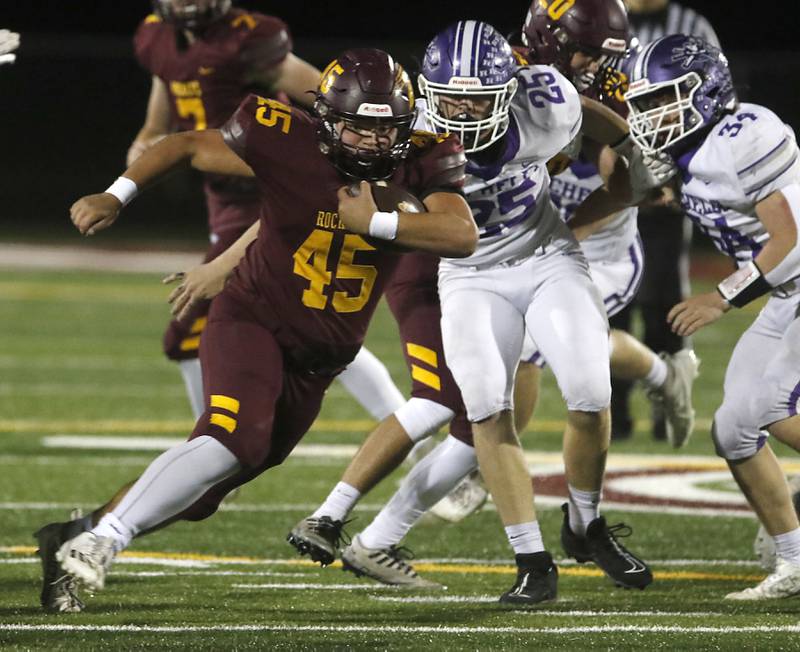 Richmond-Burton's Braxtin Nellessen tries to run away from Rochelle's Brock Metzger during a Kishwaukee River Conference football game on Friday, Oct.20, 2023, at Richmond-Burton High School.