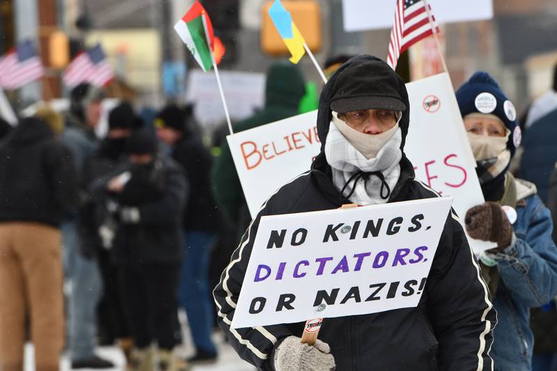 Attendees at Indivisible of Ogle County's protest lined sidewalks on one corner of the Ogle County Courthouse Square in downtown Oregon on Sunday Jan. 25, 2026, carrying signs criticizing the Trump administration's deployment of ICE officers and the shooting death of Alex Pretti by ICE agents on Saturday in Minneapolis.