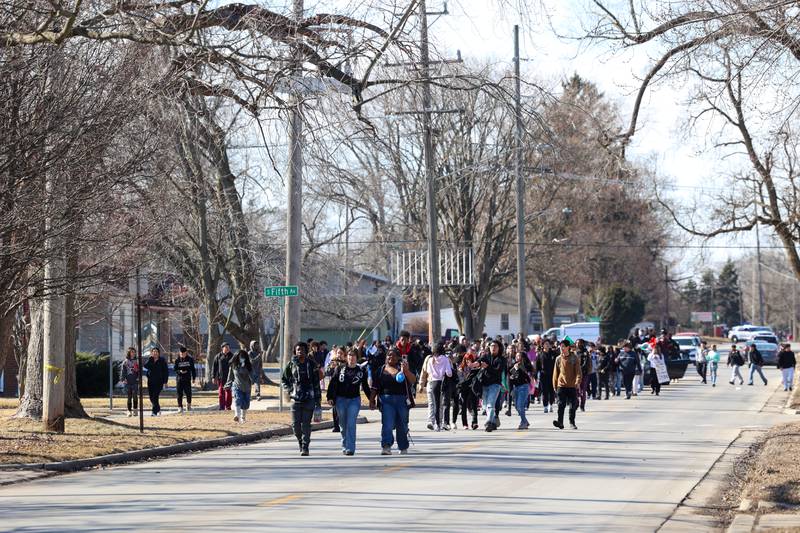 About 200 Kankakee High School students walk east on Jeffrey Street as they participate in a walkout in protest of national immigration policies and Immigration and Customs Enforcement actions on Friday, Feb. 13, 2026.