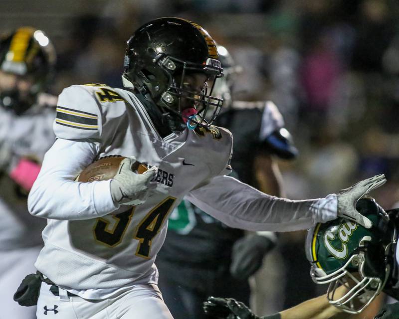 Joliet West's Tai’vaughn Johnson (34) runs in a touchdown during football game between Joliet West at Plainfield Central.   Oct 20, 2023.