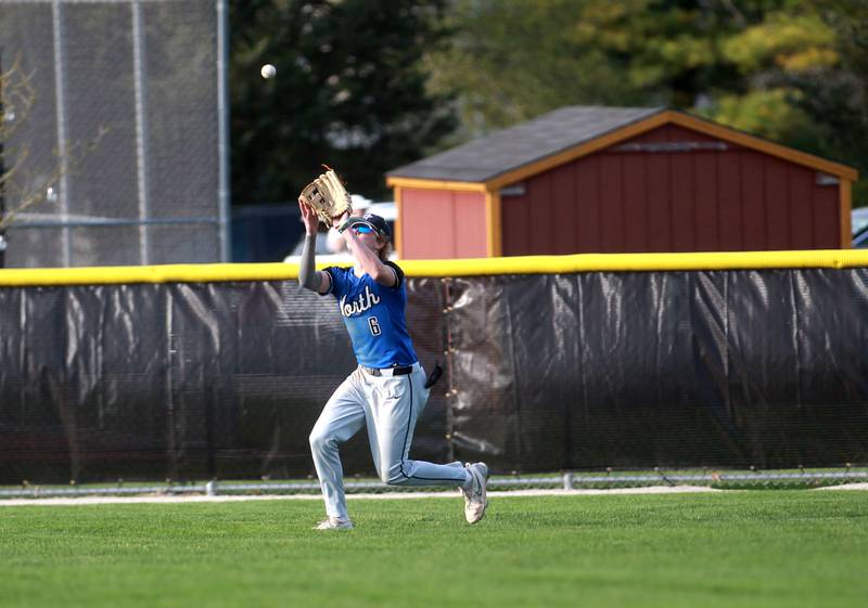 St. Charles North's Keaton Reinke makes a catch in center field during a game against Batavia on Thursday, April 24, 2025 in Batavia.