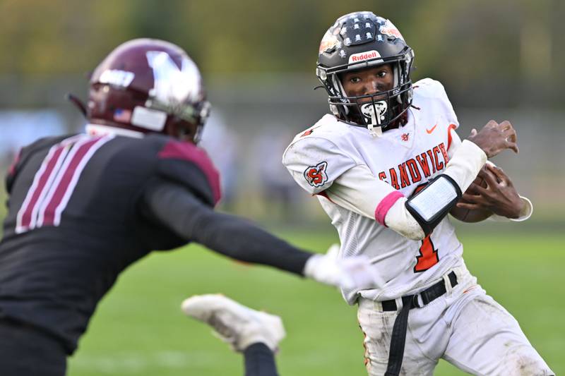 Sandwich's Simeion Harris runs for yardage against Kishwaukee River Conference rival Marengo on Saturday, Oct. 14, 2023 in Marengo.