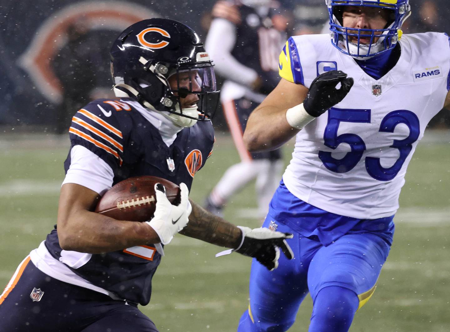 Chicago Bears wide receiver DJ Moore picks up yardage after the catch in front of Los Angeles Rams linebacker Nate Landman Sunday, Jan. 18, 2026, during their NFC divisional playoff matchup at Soldier Field in Chicago.