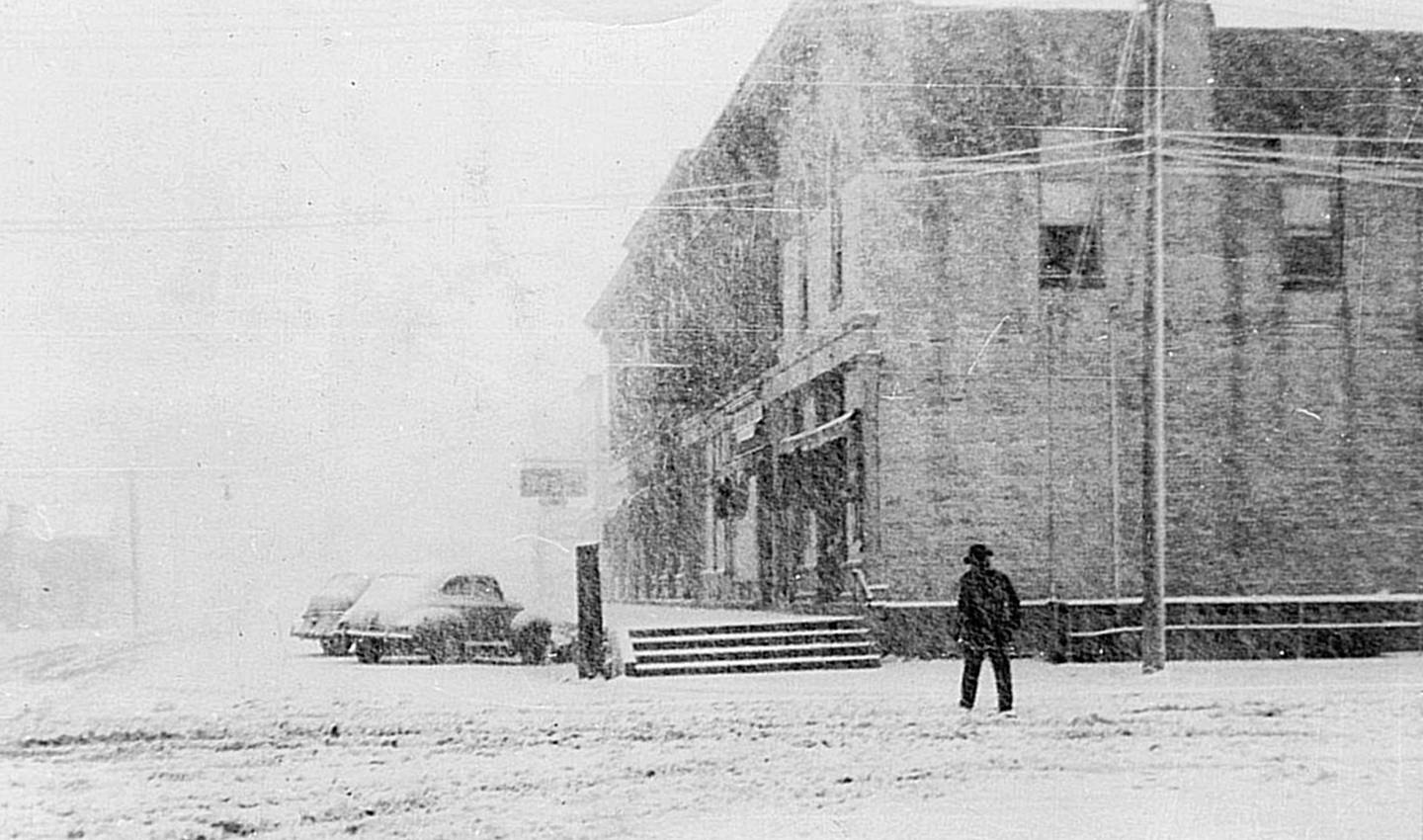 A snowy day in 1943 at the intersection of Main and Washington Street in downtown Oswego. (Photo provided by the Little White School Museum)
