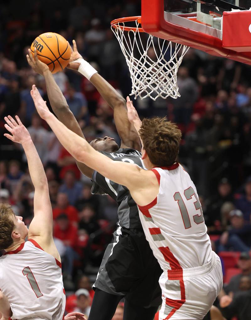 Kaneland's Jeffrey Hassan shoots over Morton's Silas Steffen for the game winning basket with one second left on the clock Monday, March 9, 2026, during their IHSA Class 3A supersectional matchup in the Convocation Center at Northern Illinois University in DeKalb.
