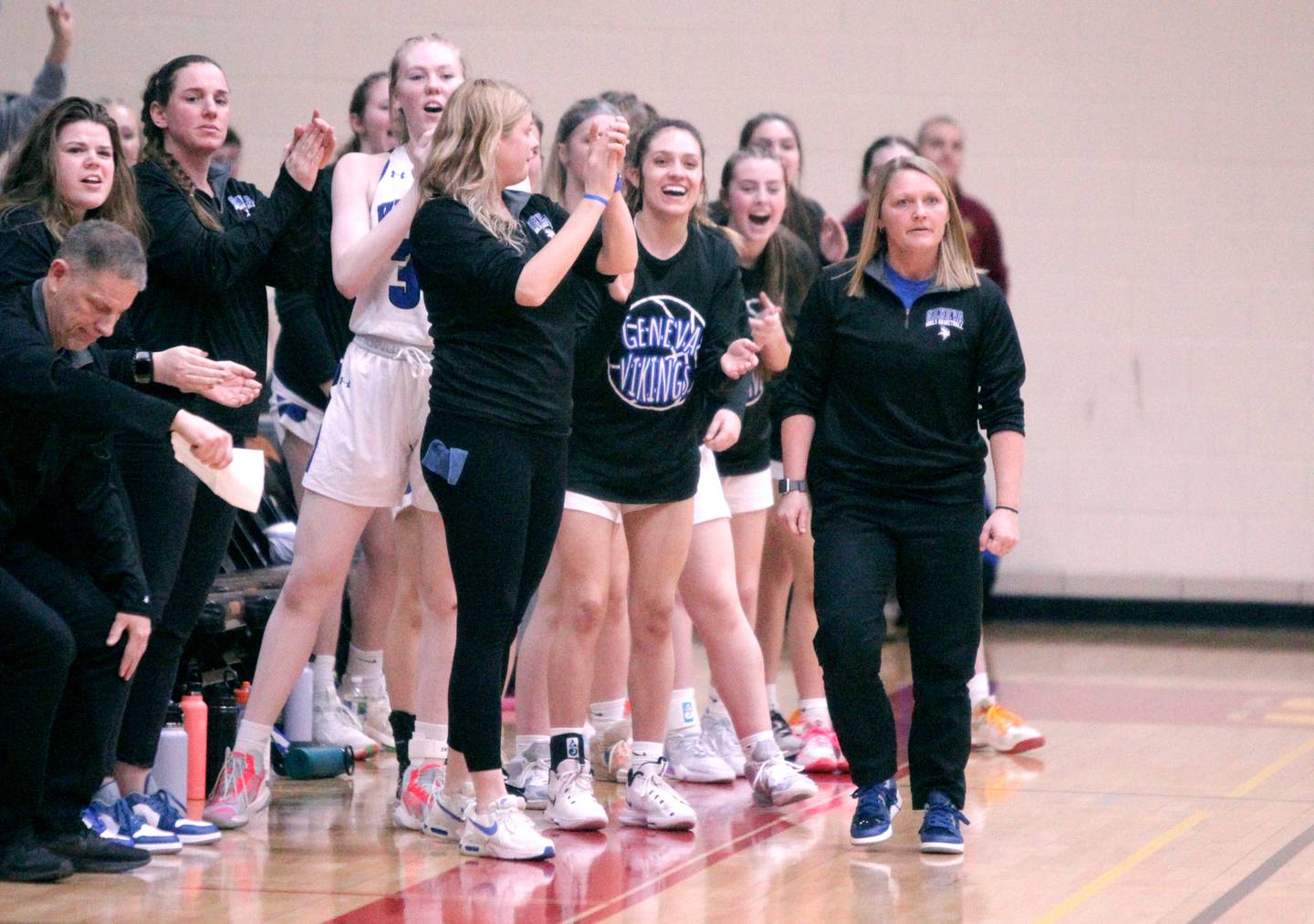 Geneva High School girls basketball Head Coach Sarah Meadows (far right) works the sidelines during a Class 4A Schaumburg Supersectional game against Barrington on Feb. 27, 2023.