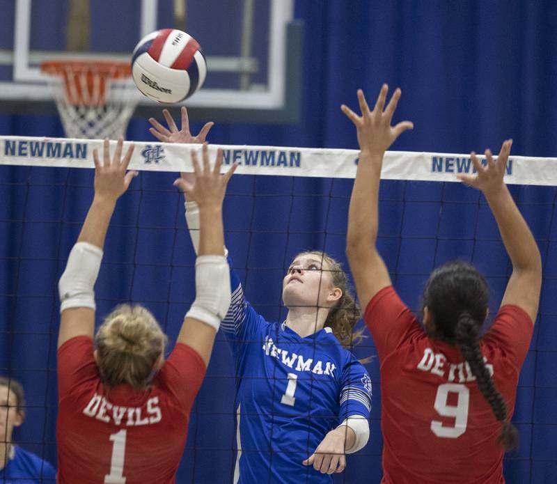 Newman’s Lauren McClain works the net against Hall’s Charlie Pellegrini (left) and Natalia Zamora Tuesday, Oct. 21, 2025.