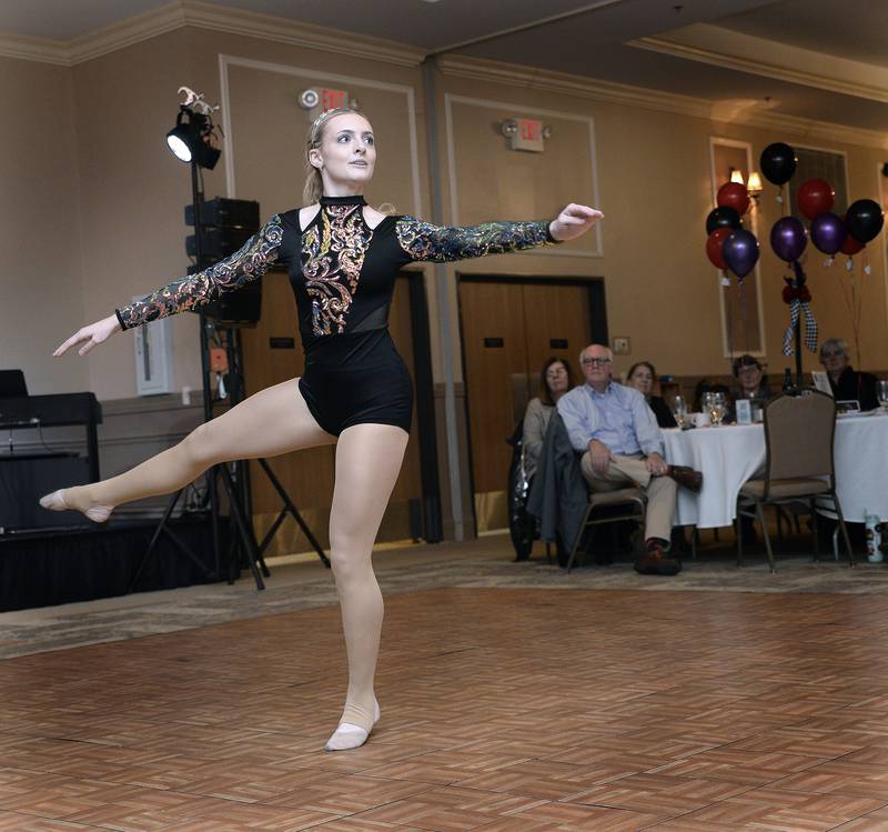Anna McLaughlin, a senior at La Salle-Peru High School, performs a dance routine before receiving an award Friday, Nov. 11, 2022, at the Grand Bear Lodge in Utica during the Mad Hatter’s Ball.