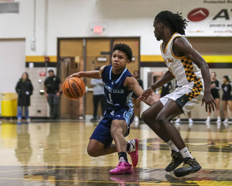 Plainfield South's Ayden Foston (1) handles the ball against the defense during their basketball game between Plainfield South at Joliet West, Feb 2, 2026 in Joliet.