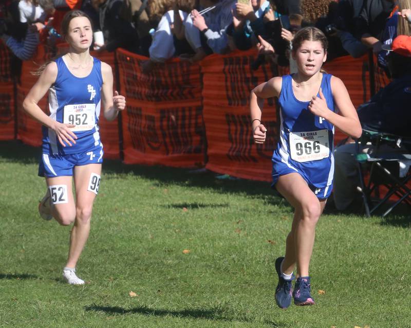 Wheaton St. Francis's Erin Hinsdale and teammate Elena Mamminga compete in the Class 2A State Cross Country race on Saturday, Nov. 4, 2023 at Detweiller Park in Peoria.