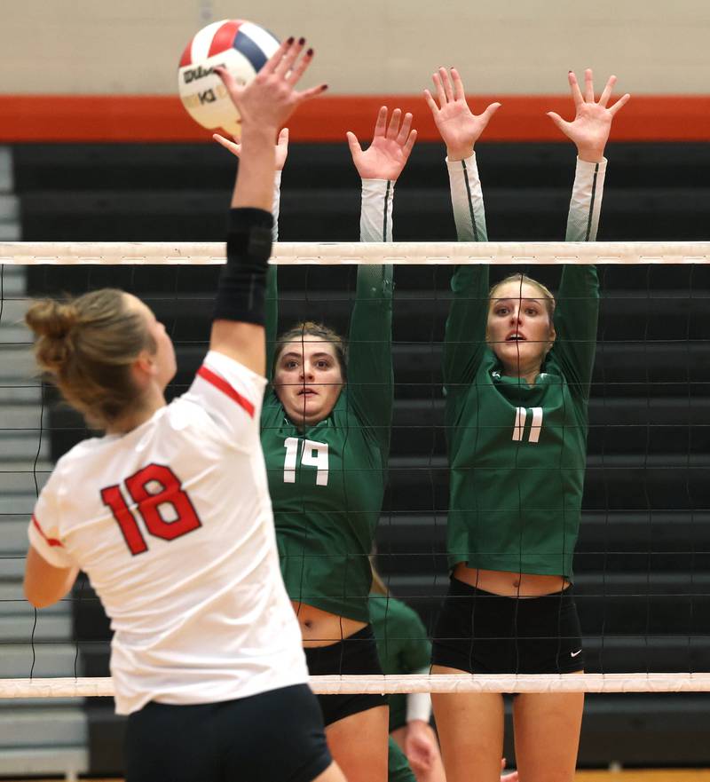 Fremd’s Victoria Belmonte (left) and Natasa Radisic try to block Huntley's Sienna Robertson Monday, Nov. 11, 2024, during their Class 4A supersectional match at DeKalb High School.