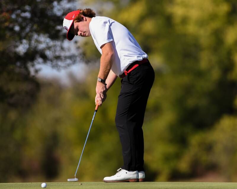 Benet Academy's Charles Davenport putts on Monday Oct. 7, 2024, during the 3A sectional match held at Blackberry Oaks Golf Course in Bristol.