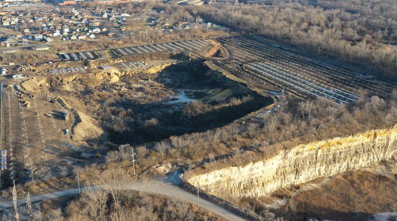 Crews prepare to erect a glass panel on the solar farm located in the 1400 block of North 27th Road (Dee Bennett Road) on Wednesday, Jan. 8, 2026 in Naplate.